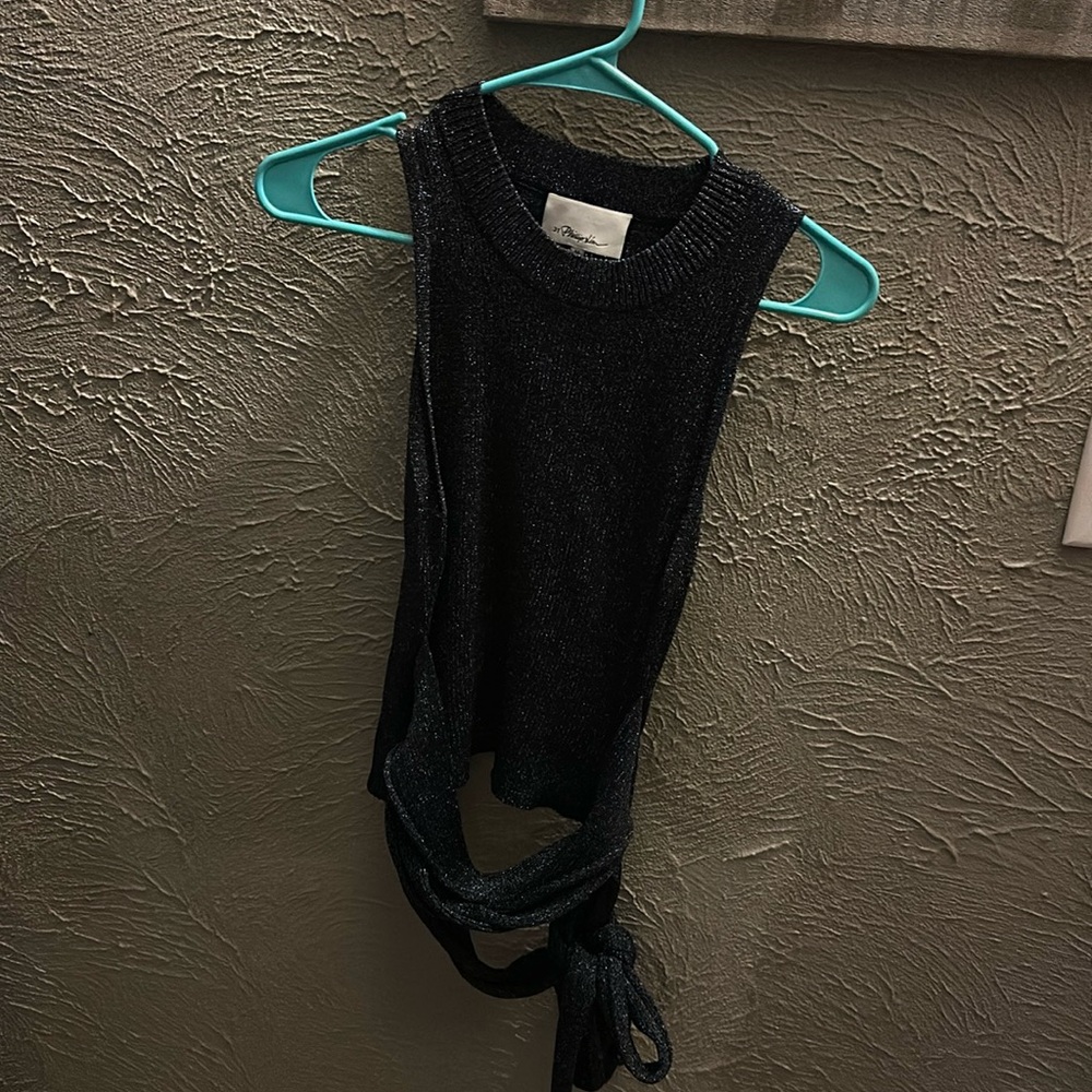 cute tank top with strappy ties at the bottom